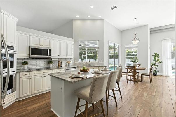 Dining room, Interior, Kitchen, Pendant Lights, Recessed Lighting, Stainless Steel Appliances, Wood Texture Flooring