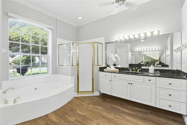 Bathroom, Dual Sink Vanities, Glass Shower, Interior, Recessed Lighting, Wood Texture Flooring