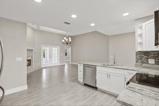Chandelier, Fireplace, Interior, Kitchen, Recessed Lighting, Wood Texture Flooring