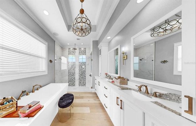 Bathroom, Chandelier, Dual Sink Vanities, Glass Shower, Interior, Pendant Lights, Recessed Lighting, Wood Texture Flooring