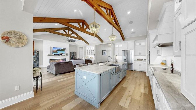Fireplace, Interior, Kitchen, Living room, Pendant Lights, Recessed Lighting, Stainless Steel Appliances, Wooden Beams, Wood Texture Flooring