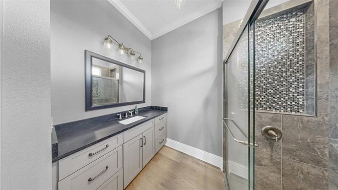 Bathroom, Dual Sink Vanities, Glass Shower, Interior, Wood Texture Flooring