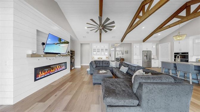 Fireplace, Interior, Kitchen, Living room, Pendant Lights, Recessed Lighting, Stainless Steel Appliances, Wooden Beams, Wood Texture Flooring