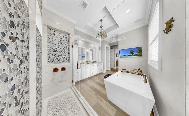 Bathroom, Free Standing Baths, Interior, Marble Walls, Pendant Lights, Recessed Lighting, Wood Texture Flooring