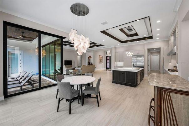 Chandelier, Dining room, Interior, Kitchen, Pendant Lights, Recessed Lighting, Stainless Steel Appliances, Wood Texture Flooring
