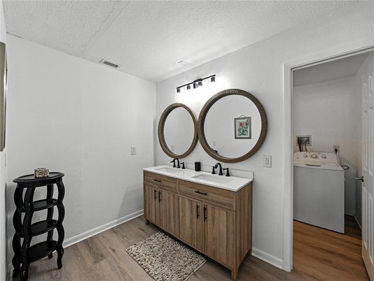 Bathroom, Dual Sink Vanities, Interior, Washer, Wood Texture Flooring