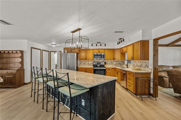 Interior, Kitchen, Pendant Lights, Stainless Steel Appliances, Wood Texture Flooring