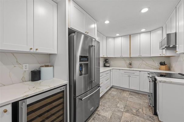 Interior, Kitchen, Marble Walls, Recessed Lighting, Stainless Steel Appliances