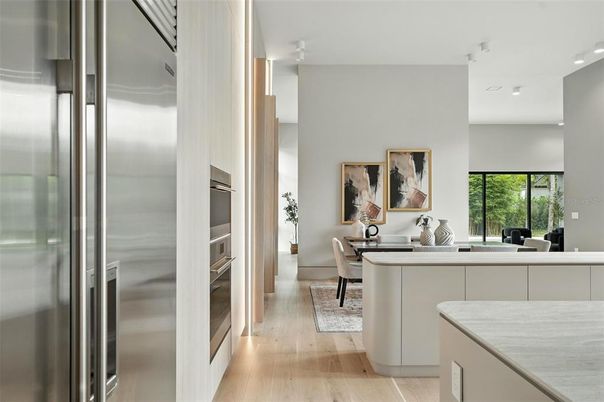 Dining room, Interior, Kitchen, Living room, Recessed Lighting, Stainless Steel Appliances, Wood Texture Flooring