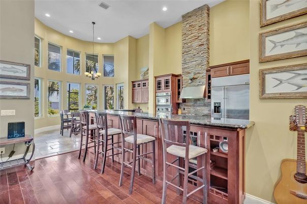 Chandelier, Dining room, Interior, Kitchen, Pendant Lights, Recessed Lighting, Stainless Steel Appliances, Wood Texture Flooring