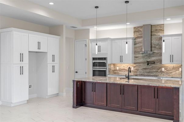 Interior, Kitchen, Marble, Pendant Lights, Recessed Lighting, Stainless Steel Appliances, Stone Walls