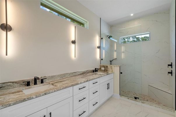 Bathroom, Dual Sink Vanities, Glass Shower, Interior, Marble, Marble Walls, Recessed Lighting