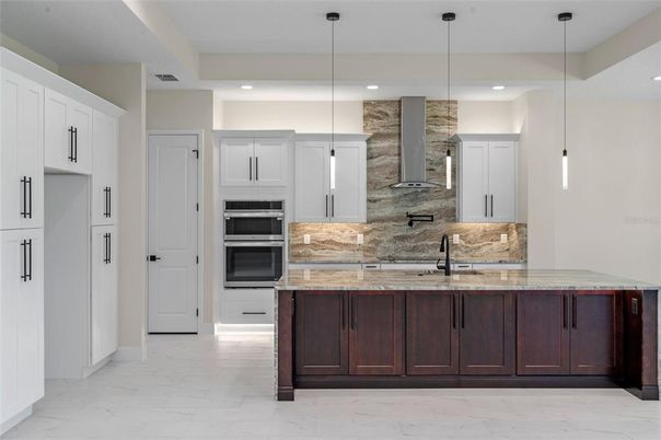 Interior, Kitchen, Marble, Pendant Lights, Recessed Lighting, Stainless Steel Appliances, Stone Walls