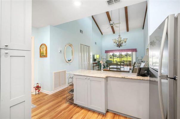 Chandelier, Interior, Kitchen, Recessed Lighting, Stainless Steel Appliances, Wood Texture Flooring