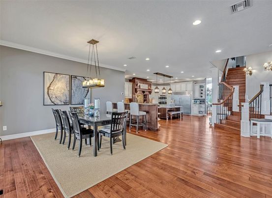 Chandelier, Dining room, Interior, Kitchen, Pendant Lights, Recessed Lighting, Stainless Steel Appliances, Wood Texture Flooring