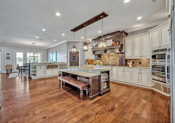 Chandelier, Dining room, Interior, Kitchen, Pendant Lights, Recessed Lighting, Stainless Steel Appliances, Wood Texture Flooring