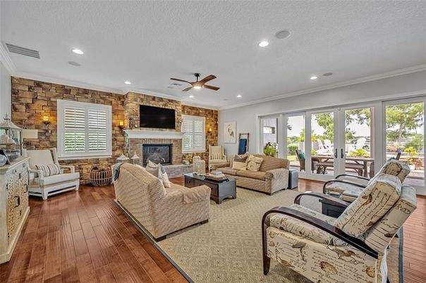 Fireplace, Interior, Living room, Recessed Lighting, Stone Walls, Wood Texture Flooring