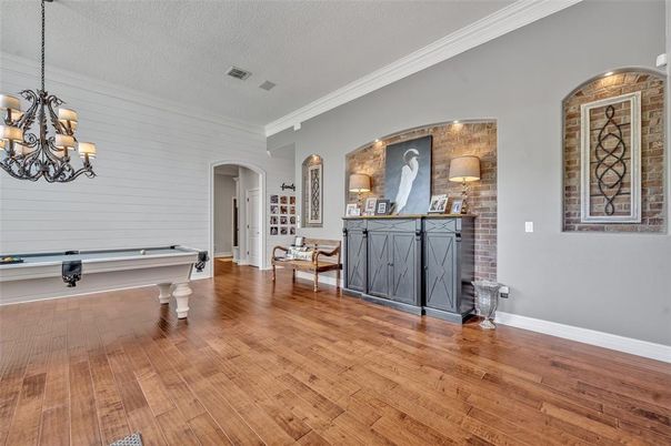 Billiard Table, Chandelier, Game Room, Interior, Pendant Lights, Stone Walls, Wood Texture Flooring