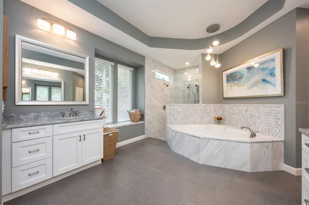Bathroom, Dual Sink Vanities, Glass Shower, Interior, Marble Walls, Pendant Lights, Recessed Lighting
