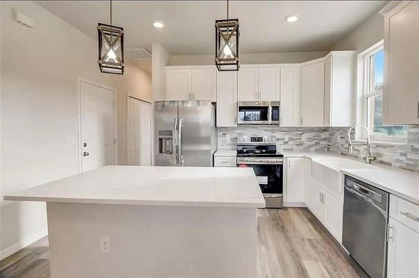 Interior, Kitchen, Pendant Lights, Recessed Lighting, Stainless Steel Appliances, Wood Texture Flooring