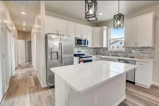 Interior, Kitchen, Pendant Lights, Recessed Lighting, Stainless Steel Appliances, Wood Texture Flooring
