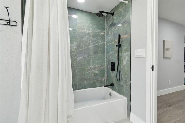 Bathroom, Glass Shower, Interior, Marble Walls, Recessed Lighting, Wood Texture Flooring