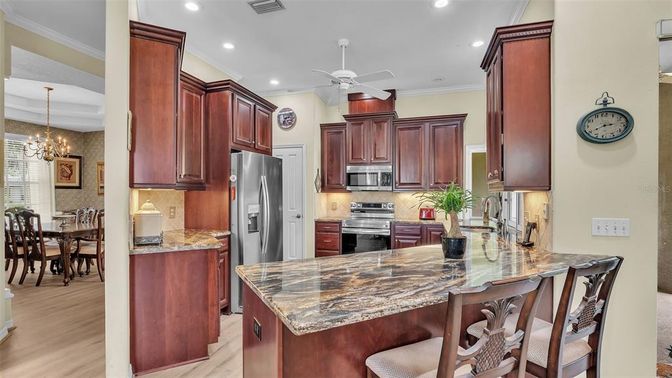 Chandelier, Dining room, Interior, Kitchen, Recessed Lighting, Stainless Steel Appliances, Wood Texture Flooring