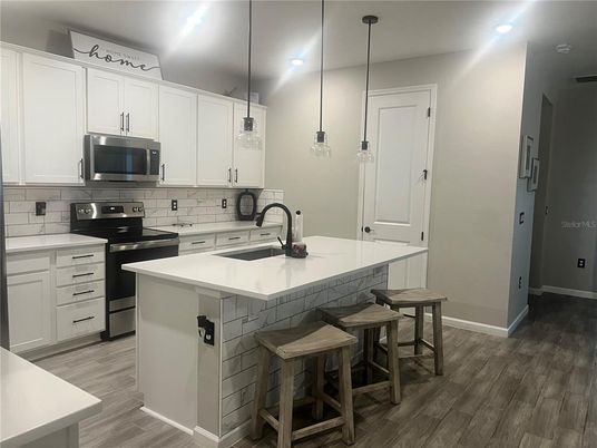 Interior, Kitchen, Pendant Lights, Recessed Lighting, Stainless Steel Appliances, Wood Texture Flooring