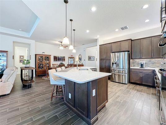 Dining room, Interior, Kitchen, Pendant Lights, Recessed Lighting, Stainless Steel Appliances, Wood Texture Flooring