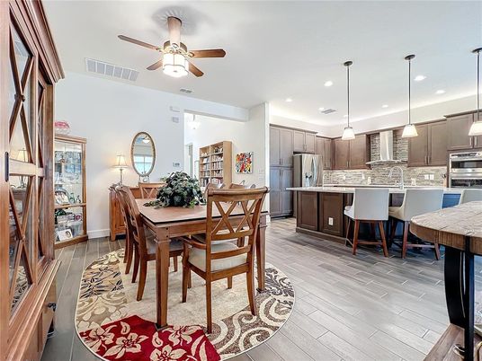 Dining room, Interior, Kitchen, Pendant Lights, Recessed Lighting, Stainless Steel Appliances, Wood Texture Flooring