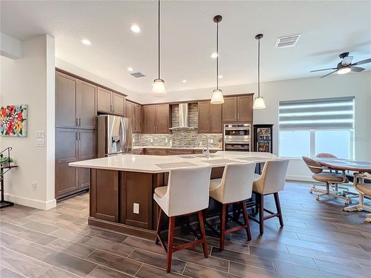 Dining room, Interior, Kitchen, Pendant Lights, Recessed Lighting, Stainless Steel Appliances, Wood Texture Flooring