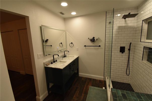 Bathroom, Dual Sink Vanities, Glass Shower, Interior, Recessed Lighting, Wood Texture Flooring