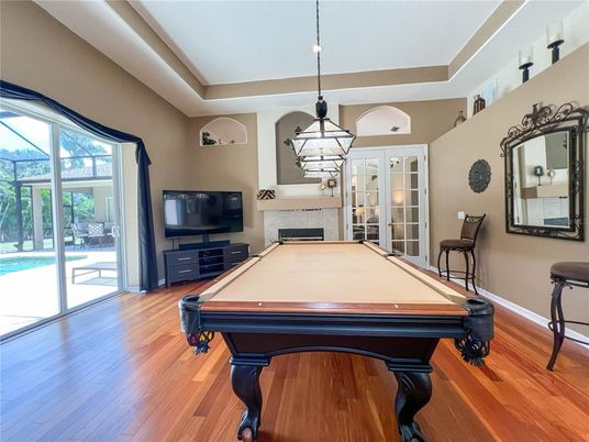 Billiard Table, Fireplace, Game Room, Interior, Pendant Lights, Wood Texture Flooring