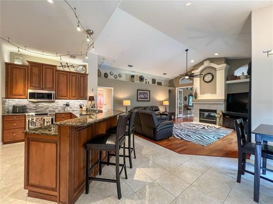 Dining room, Fireplace, Interior, Kitchen, Living room, Pendant Lights, Recessed Lighting, Wood Texture Flooring