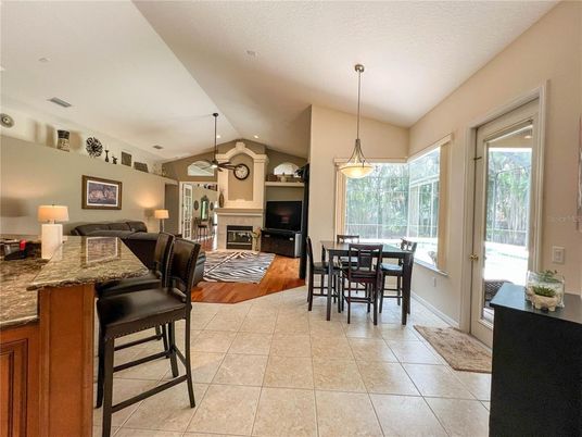 Dining room, Fireplace, Interior, Living room, Pendant Lights, Recessed Lighting, Wood Texture Flooring