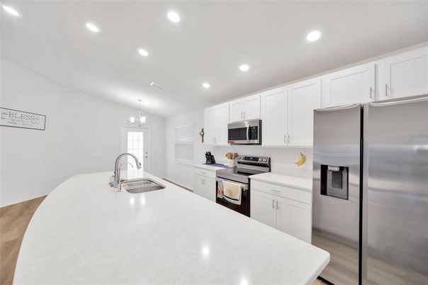 Chandelier, Interior, Kitchen, Recessed Lighting, Stainless Steel Appliances, Wood Texture Flooring