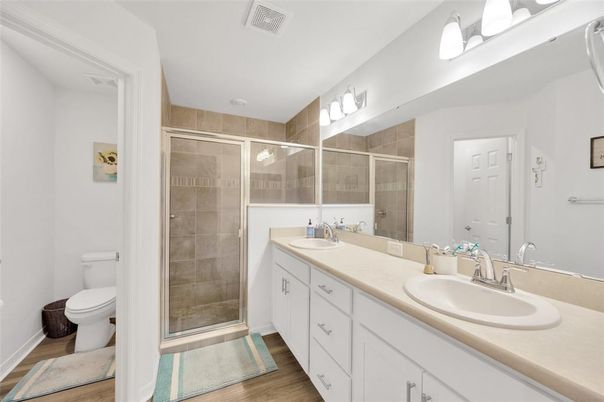 Bathroom, Dual Sink Vanities, Glass Shower, Interior, Wood Texture Flooring