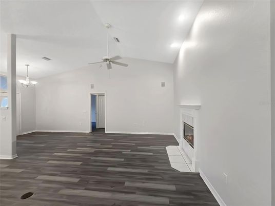 Chandelier, Empty room, Fireplace, Interior, Recessed Lighting, Wood Texture Flooring