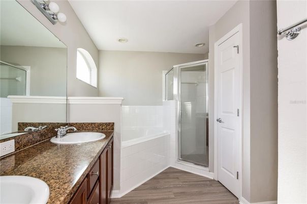 Bathroom, Dual Sink Vanities, Glass Shower, Interior, Recessed Lighting, Wood Texture Flooring