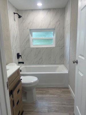 Bathroom, Interior, Marble Walls, Recessed Lighting, Wood Texture Flooring