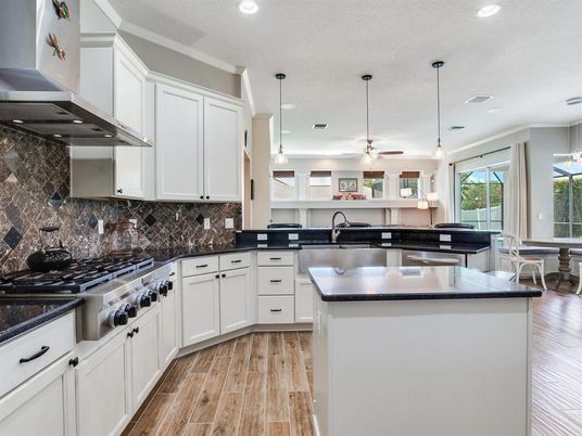 Dining room, Interior, Kitchen, Pendant Lights, Recessed Lighting, Stainless Steel Appliances, Wood Texture Flooring