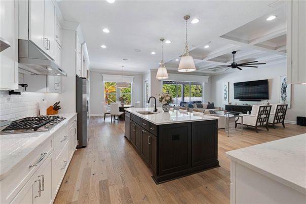 Dining room, Interior, Kitchen, Living room, Pendant Lights, Recessed Lighting, Stainless Steel Appliances, Wood Texture Flooring