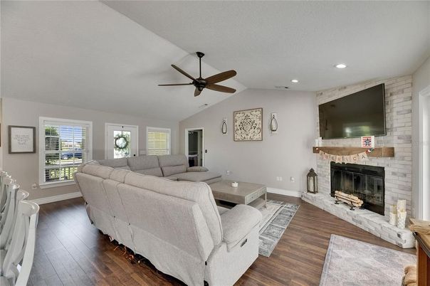 Fireplace, Interior, Living room, Recessed Lighting, Stone Walls, Wood Texture Flooring