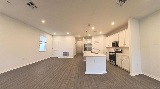 Interior, Kitchen, Pendant Lights, Recessed Lighting, Stainless Steel Appliances, Wood Texture Flooring