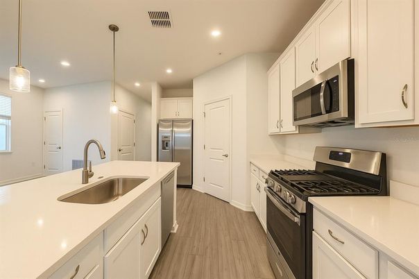 Interior, Kitchen, Pendant Lights, Recessed Lighting, Stainless Steel Appliances, Wood Texture Flooring