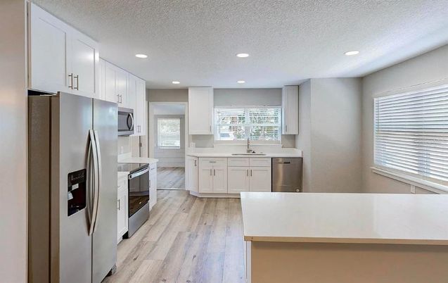 Interior, Kitchen, Recessed Lighting, Stainless Steel Appliances, Wood Texture Flooring