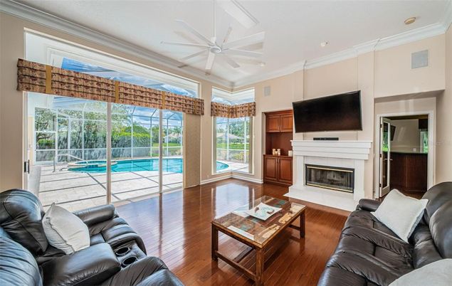 Fireplace, Interior, Living room, Recessed Lighting, Sun Room, Wood Texture Flooring