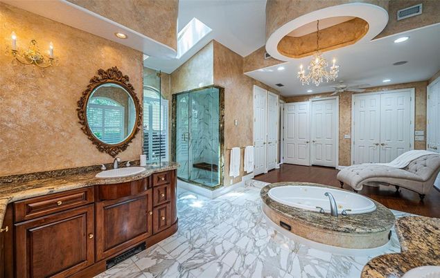Bathroom, Chandelier, Dual Sink Vanities, Glass Shower, Interior, Marble, Recessed Lighting