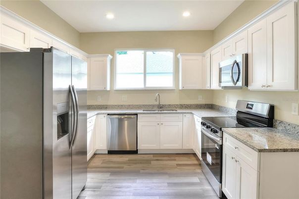 Interior, Kitchen, Recessed Lighting, Stainless Steel Appliances, Wood Texture Flooring