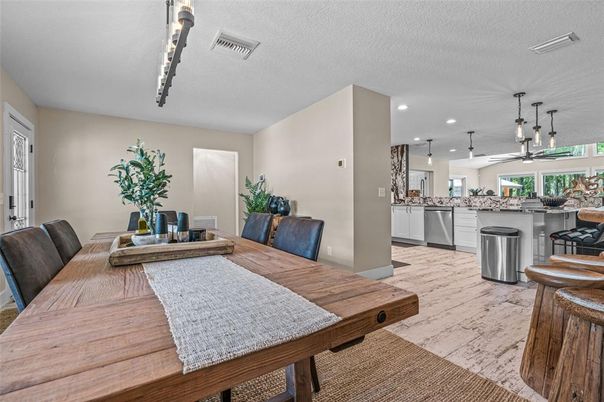 Dining room, Interior, Kitchen, Pendant Lights, Recessed Lighting, Stainless Steel Appliances, Wood Texture Flooring